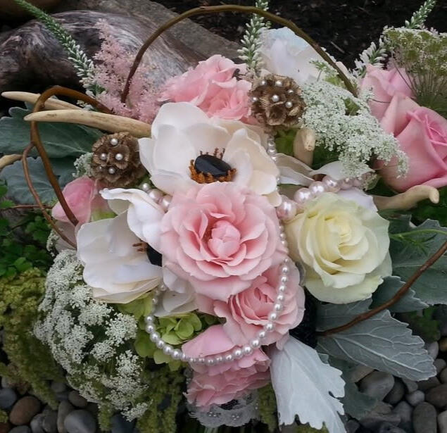 Bouquet featuring antlers, lace, and pearls